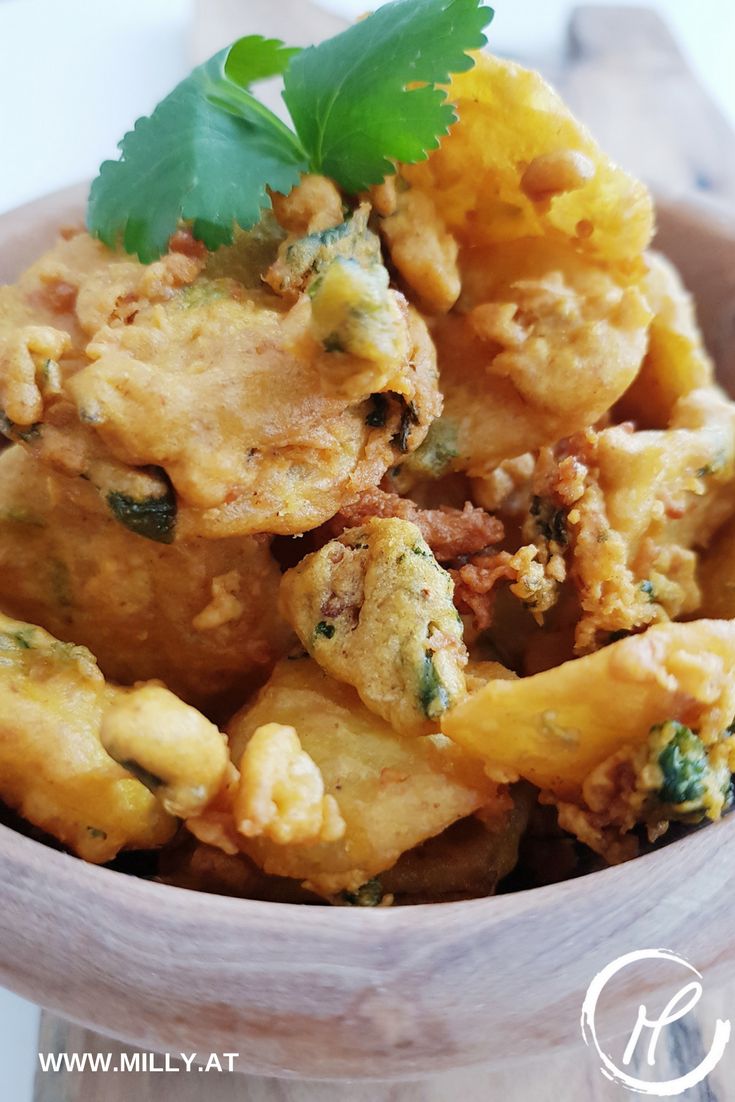 Bhajias are vegetable fritters in a chickpea-flour batter! Here I serve them with a refreshing corainder and mint chutney, a welcome couterweight to the fritters! #recipe #easy #indian #snack #fingerfood